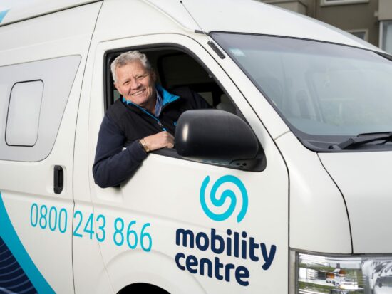 Image of a Mobility Centre staff member driving a Mobility Centre van