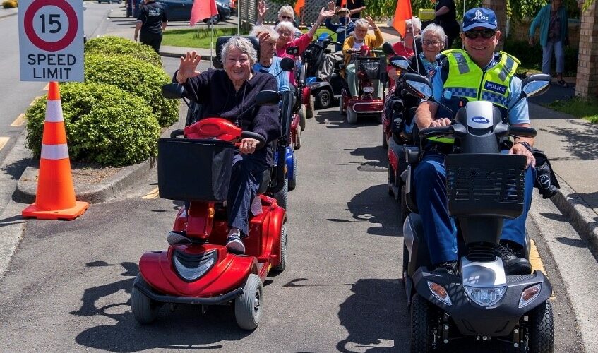 Informative image showing a group enjoying mobility scooter training