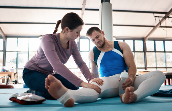 A person with fibromyalgia receiving support while stretching.